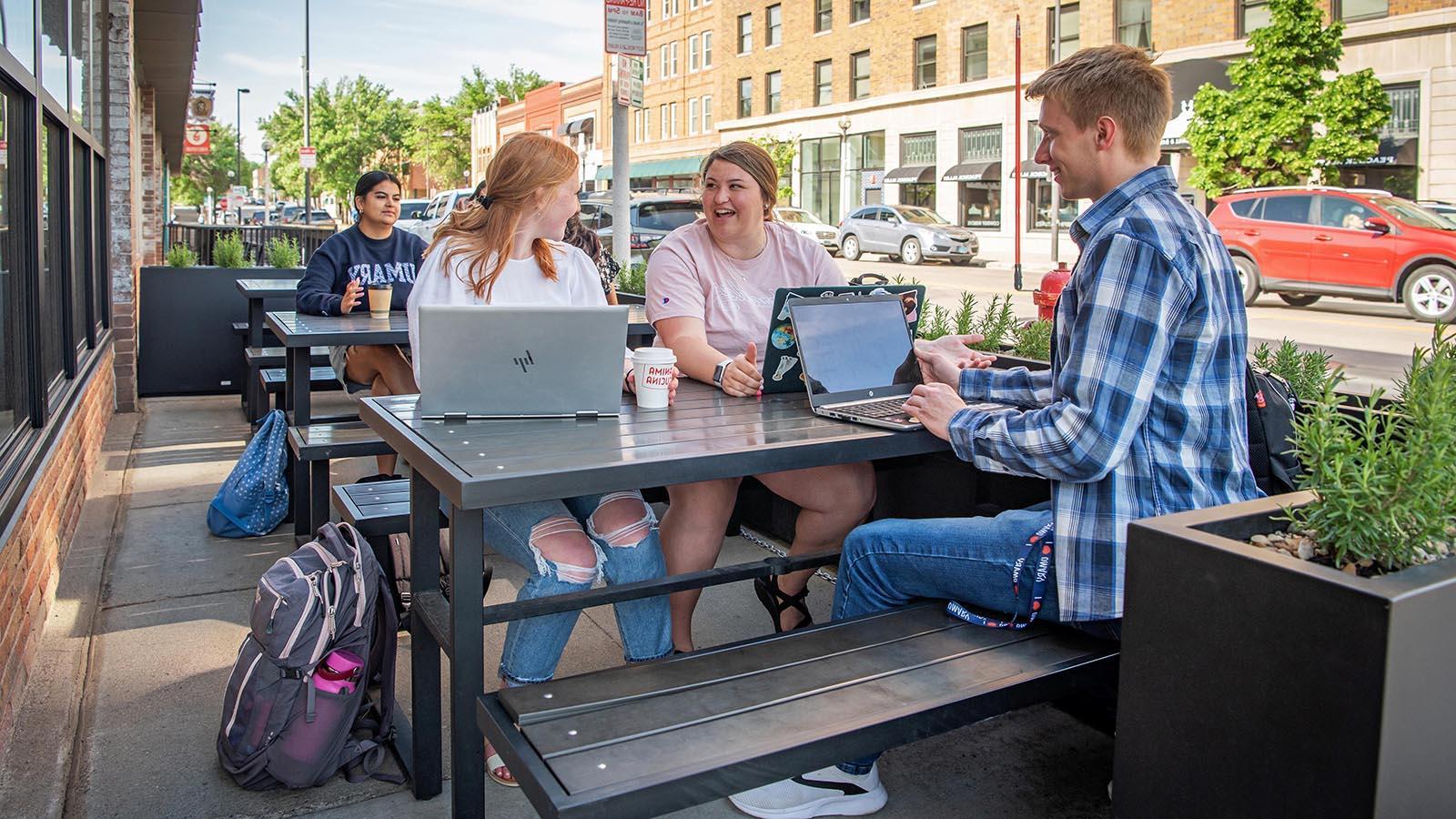 Four Year-Round Campus students studying at a downtown Bismarck business.
